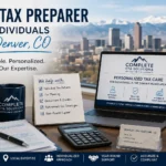 Tax preparation workspace overlooking Denver with Form 1040, calculator, tax planning materials, and laptop representing individual tax preparation services.